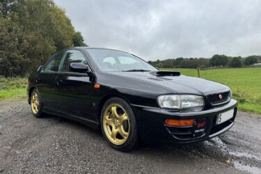 Subaru Impreza STI Saloon 4 door version 4 1998 in black mica, 62126 miles. Image