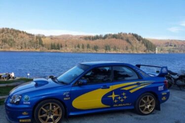 Subaru Impreza Wrx Sti. Ultra low miles. World rally blue and iconic gold wheels Image